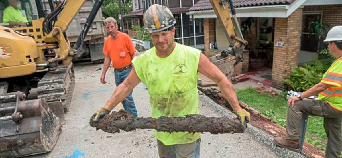Workers pull out old lead pipe in pittsburgh